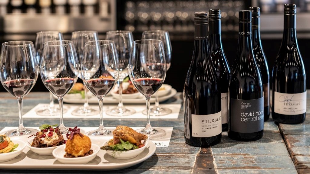 food and wine on a bench